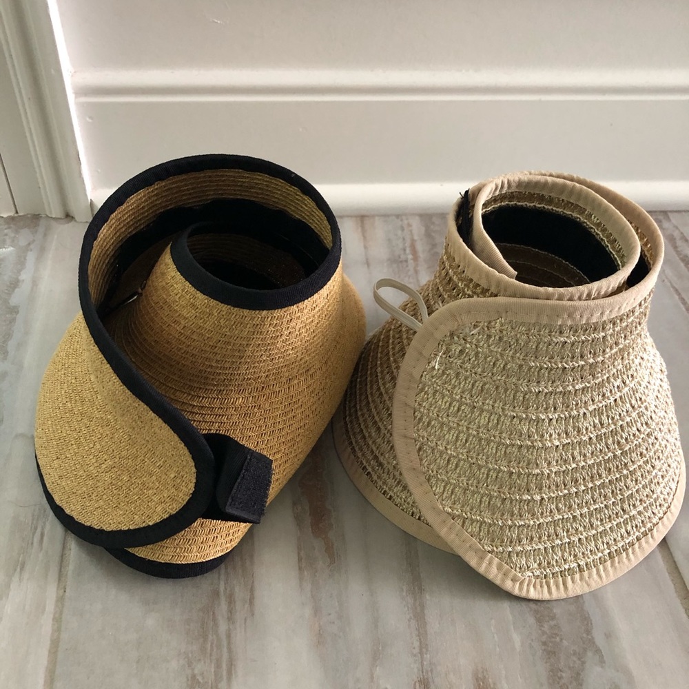 A pair of wrap around brim straw hats